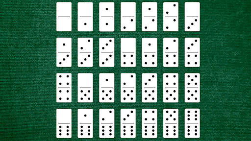 28 double-six dominoes lying face-up on the middle of the table.